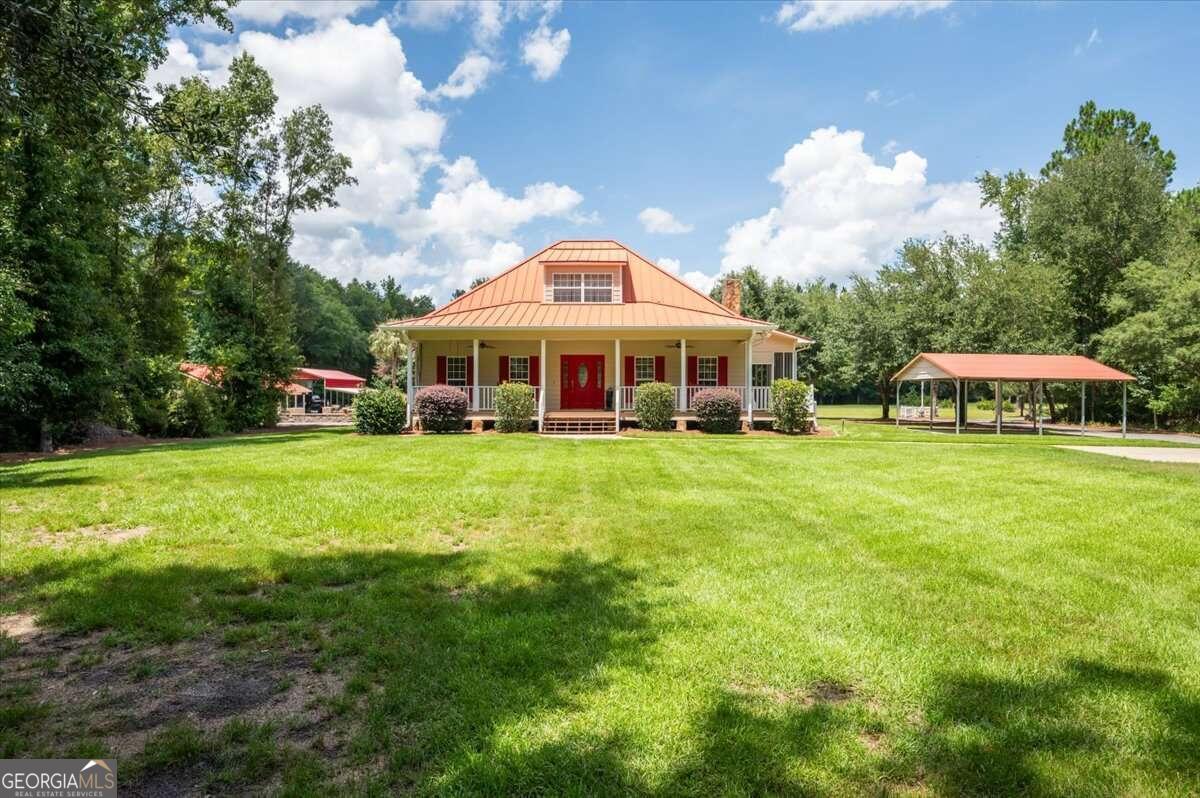 a view of a house with a big yard