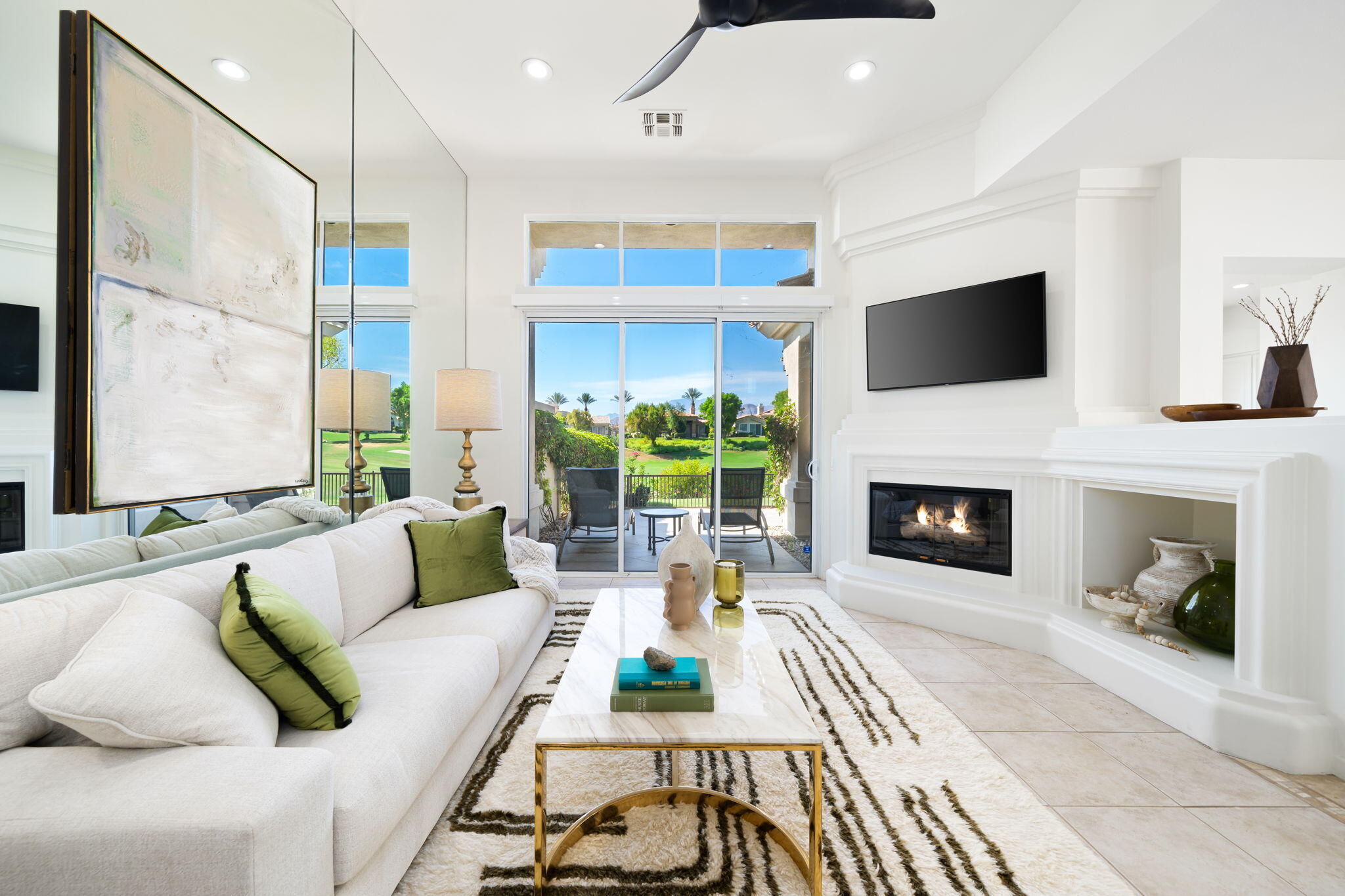 a living room with furniture fireplace and a flat screen tv