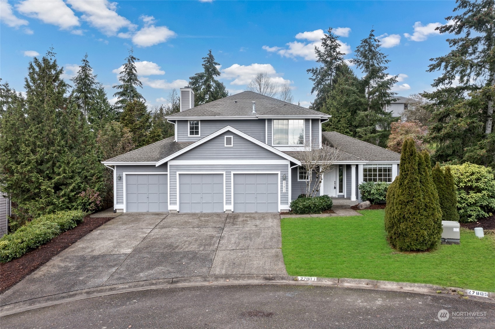 front view of a house with a yard