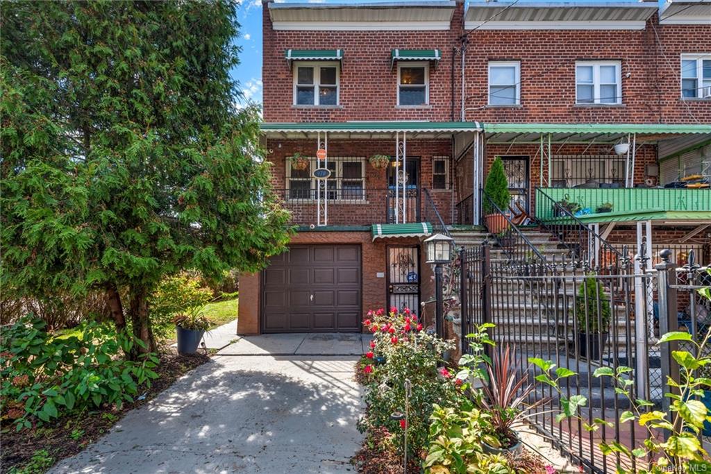 Multi unit property with covered porch and a garage