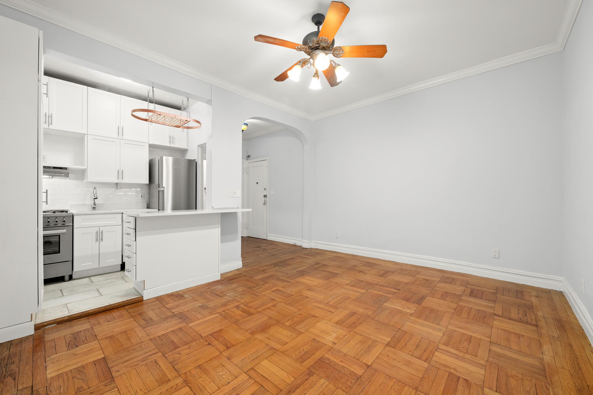 a view of a kitchen with a sink and cabinets