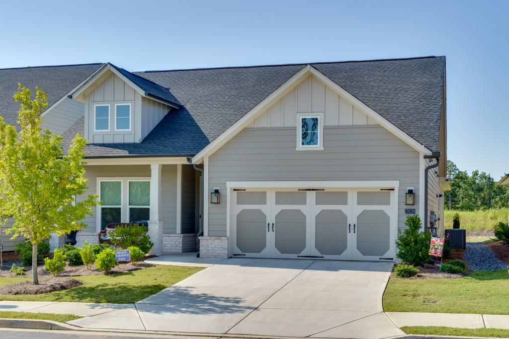 a front view of a house with garden