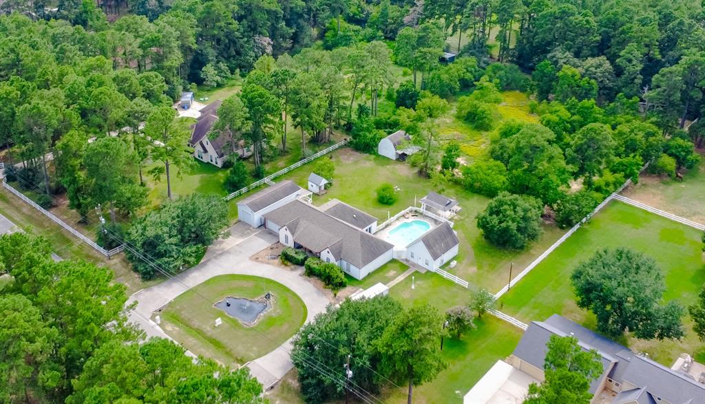 an aerial view of residential house with outdoor space and swimming pool