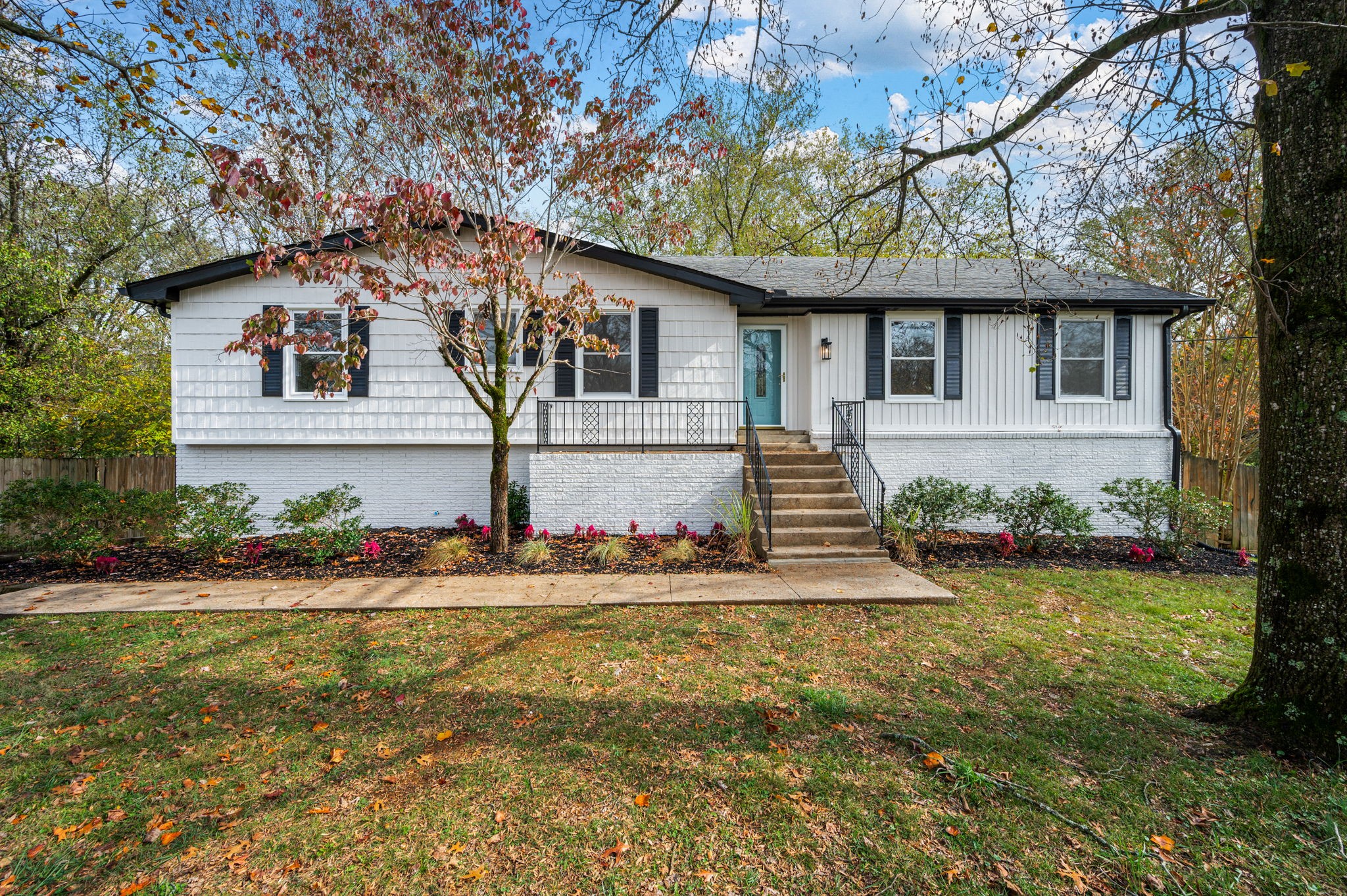 a front view of house with yard and green space