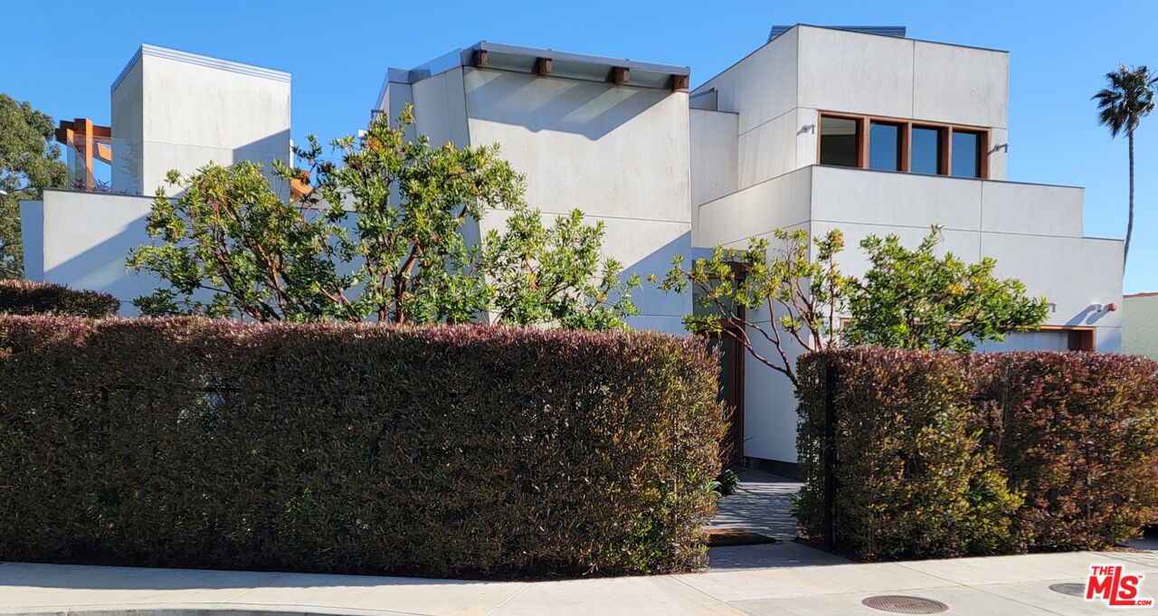 a view of a house with a flower garden