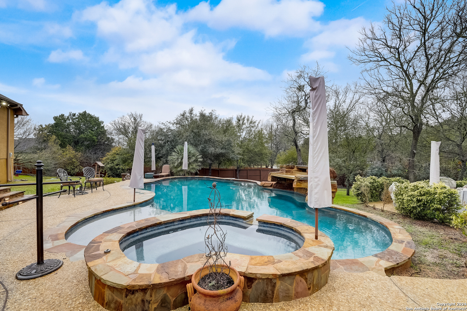 a view of a swimming pool with a patio