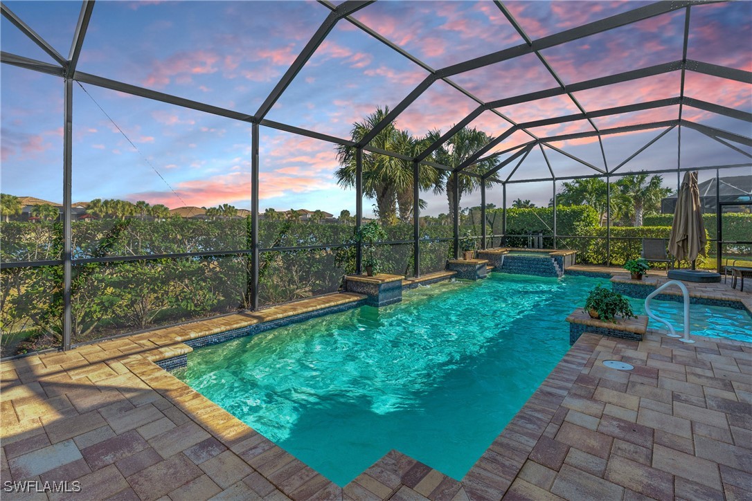 a view of swimming pool with a patio