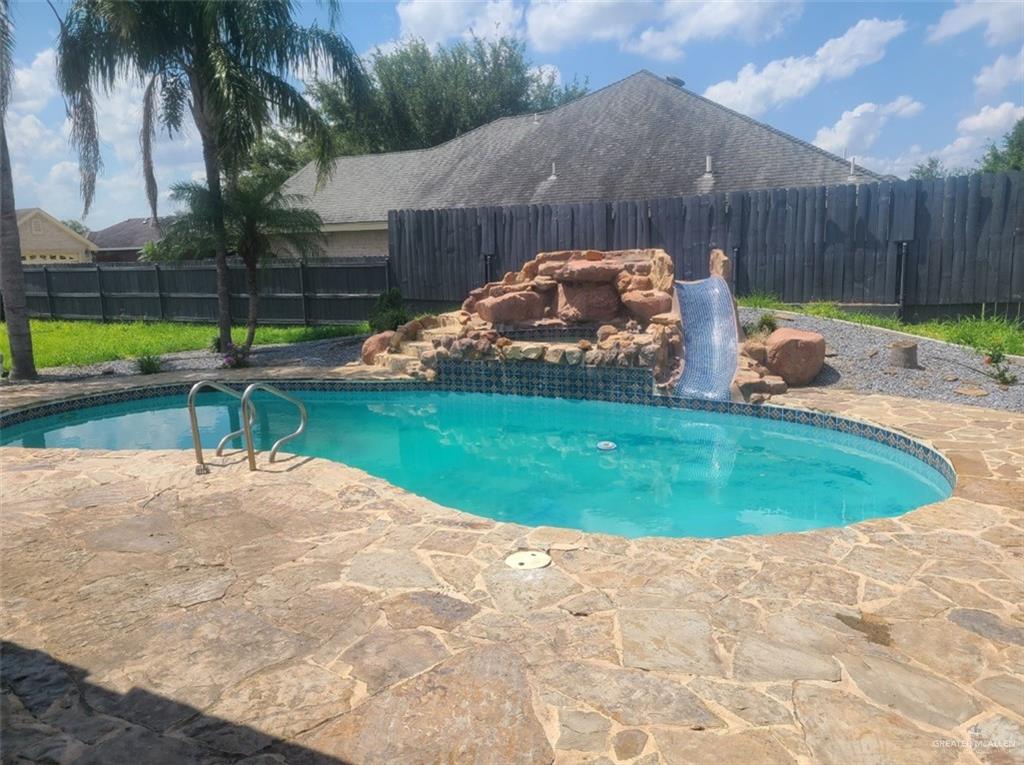 a view of a backyard with a sitting area