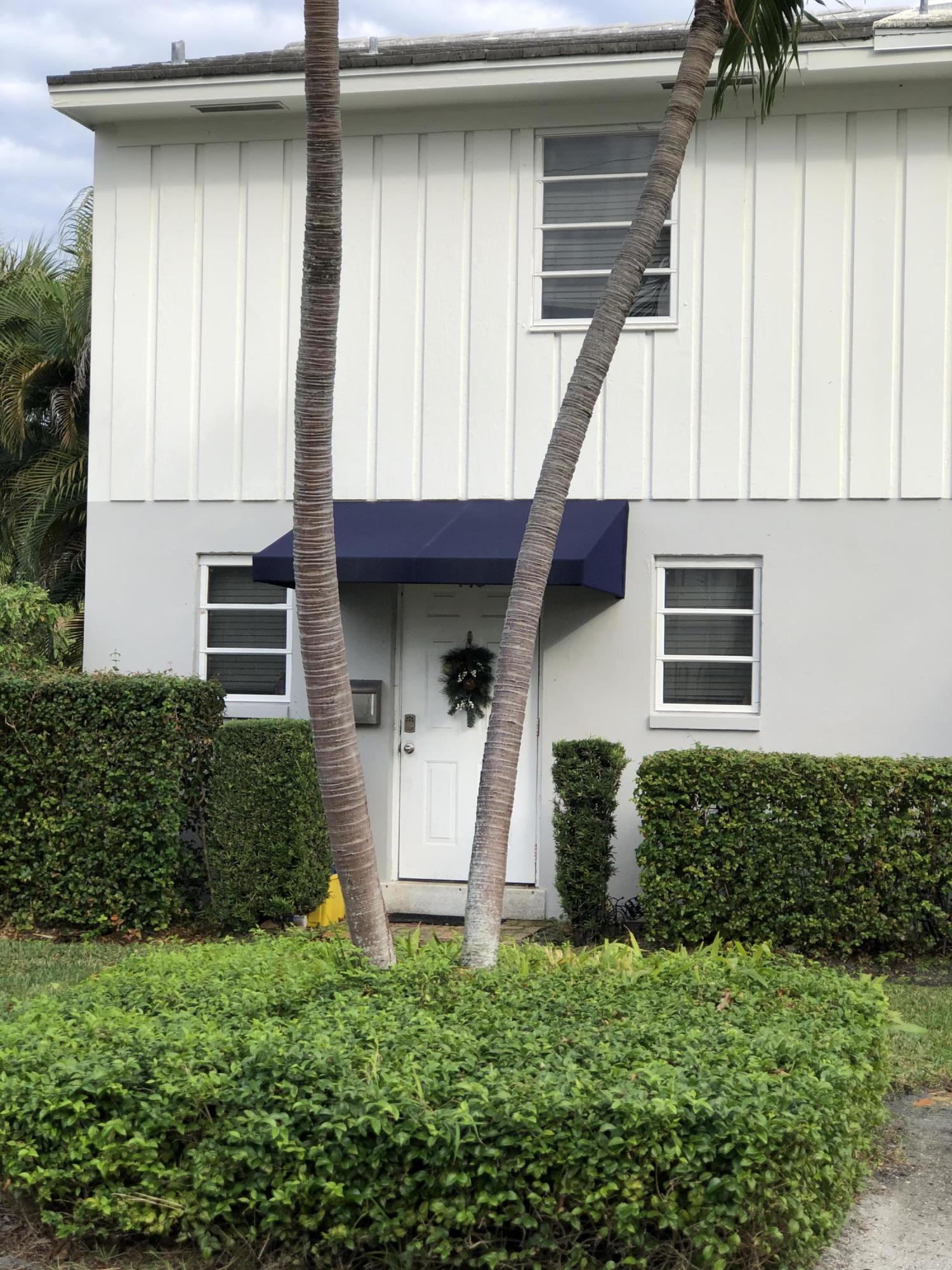 a front view of a house with garage