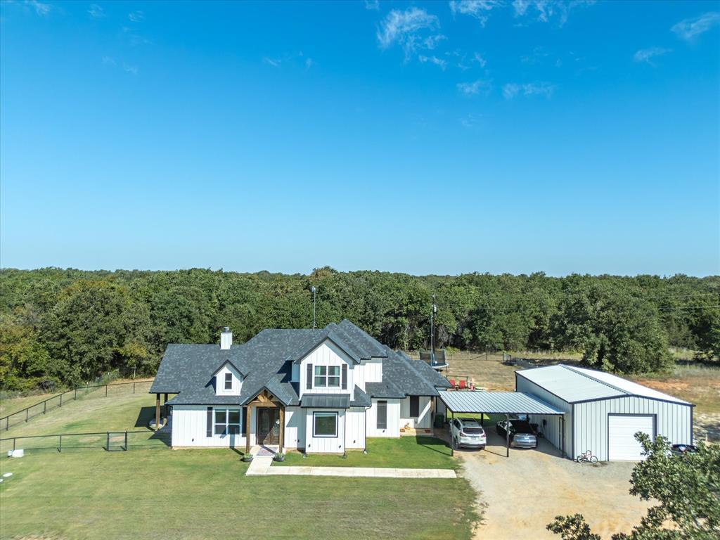 a aerial view of a house with a big yard