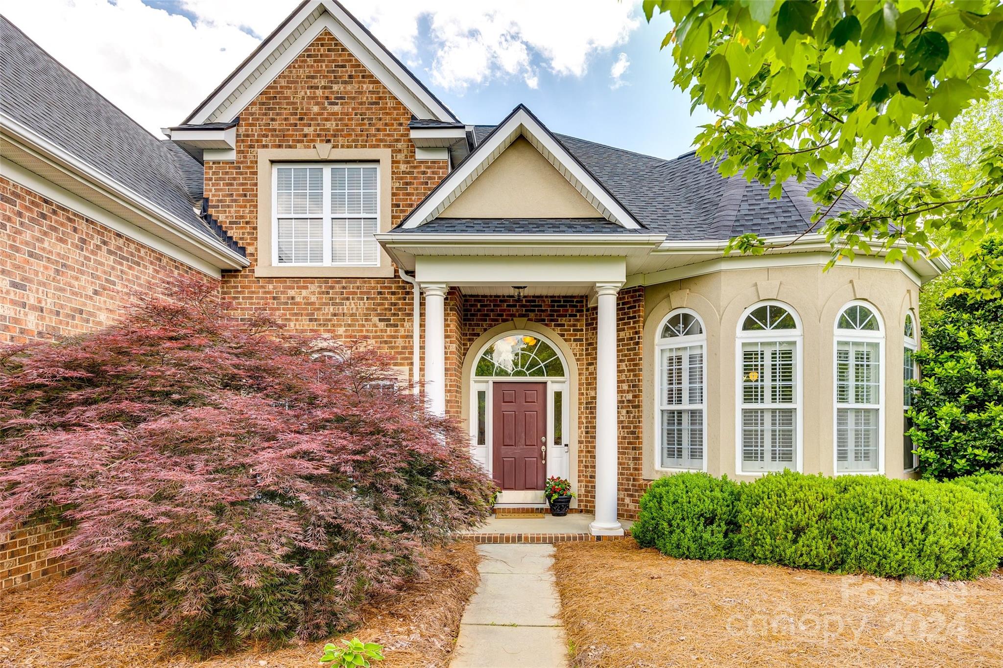 front view of a house with a yard