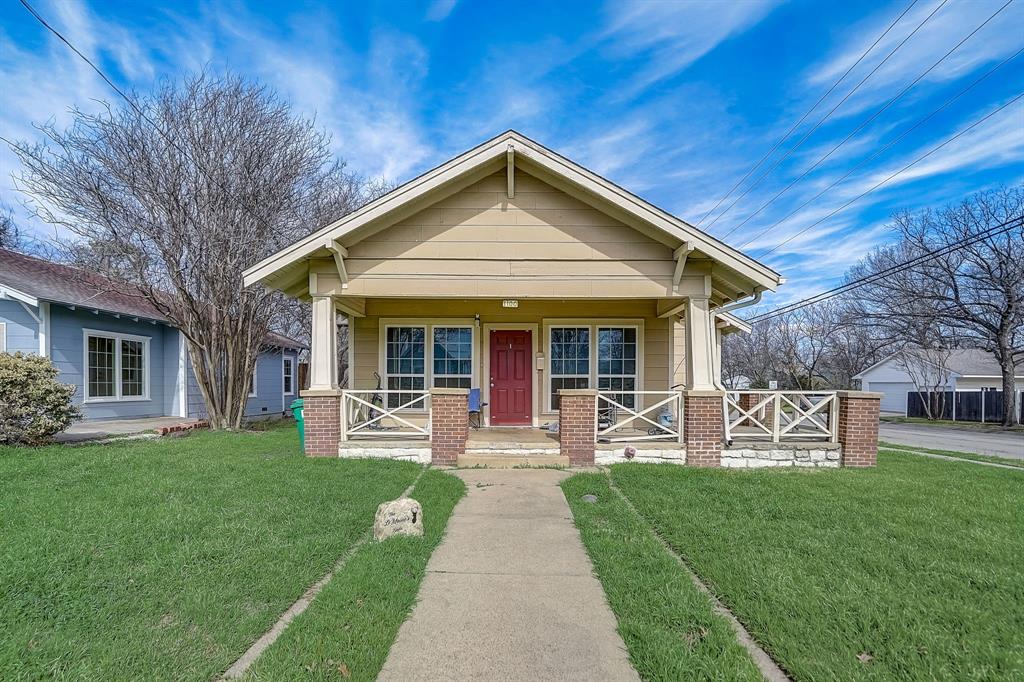 a front view of a house with garden and porch