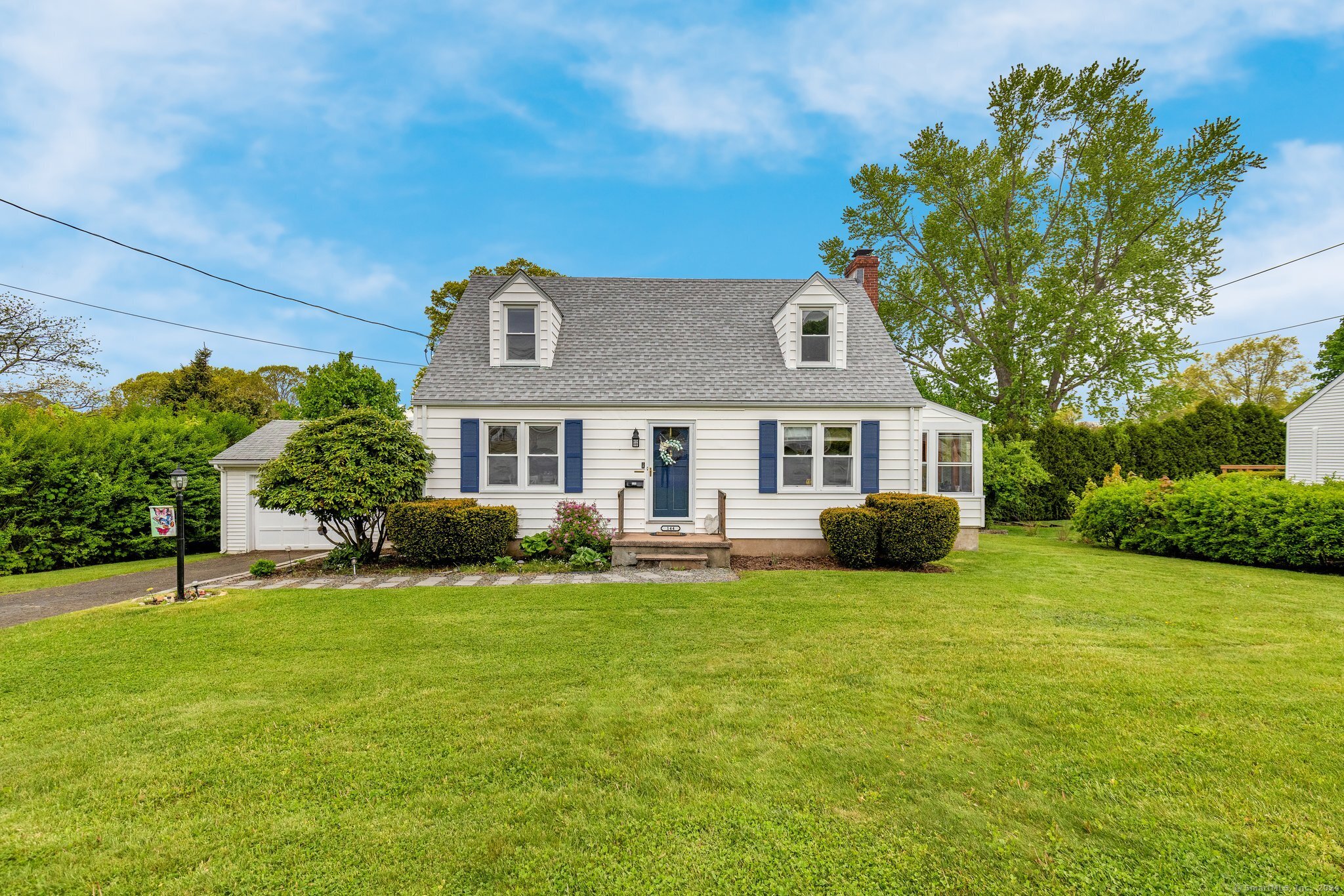 a front view of a house with a yard