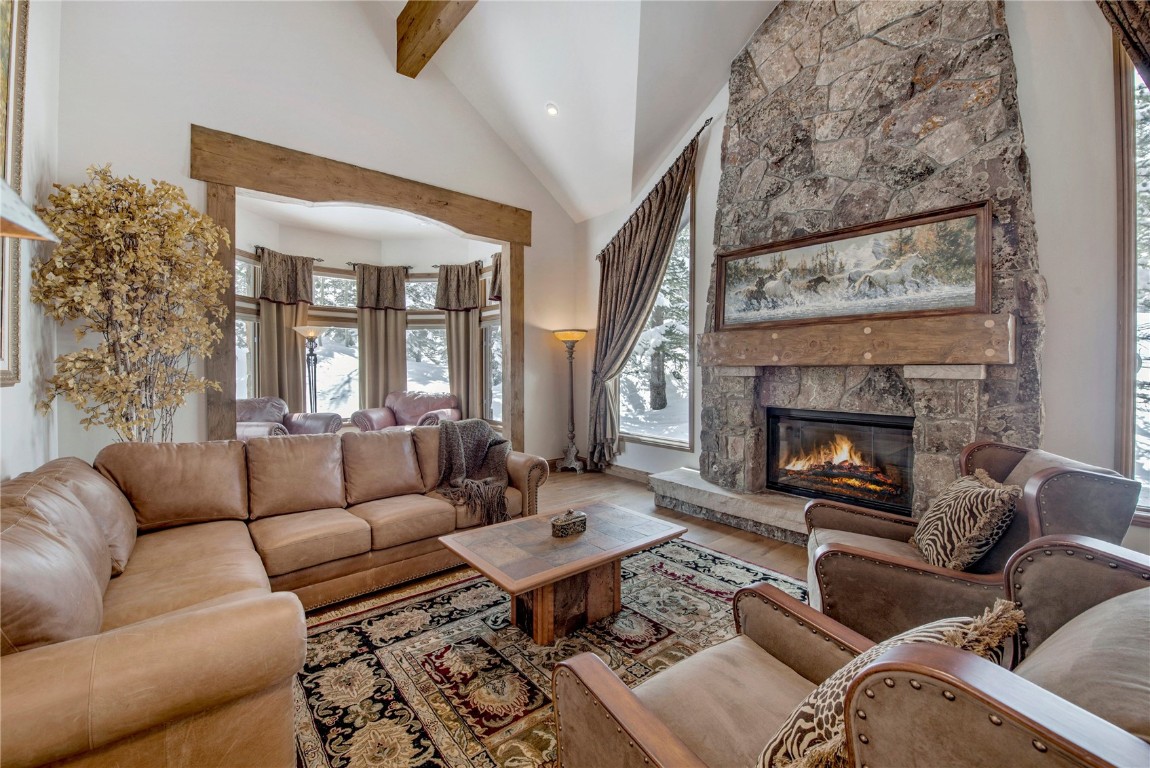 a living room with furniture fireplace and window