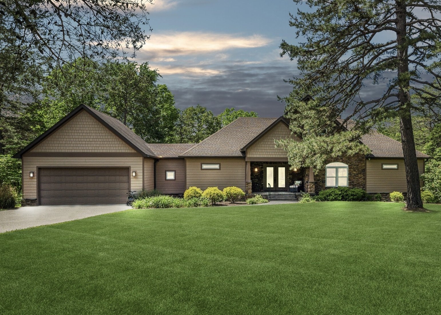 a front view of house with yard and green space