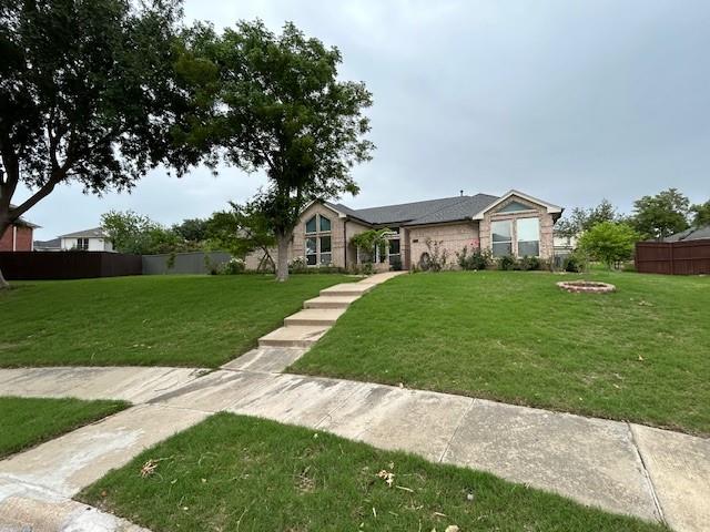 a view of a front of a house with a yard