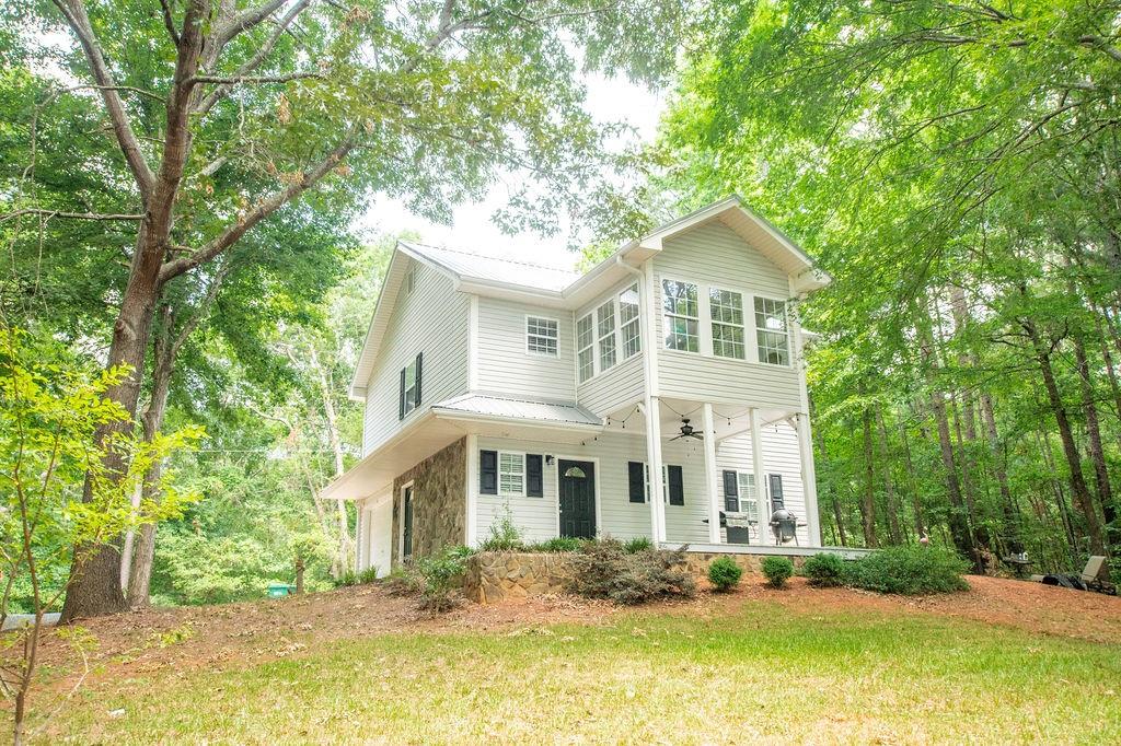 a front view of a house with a yard