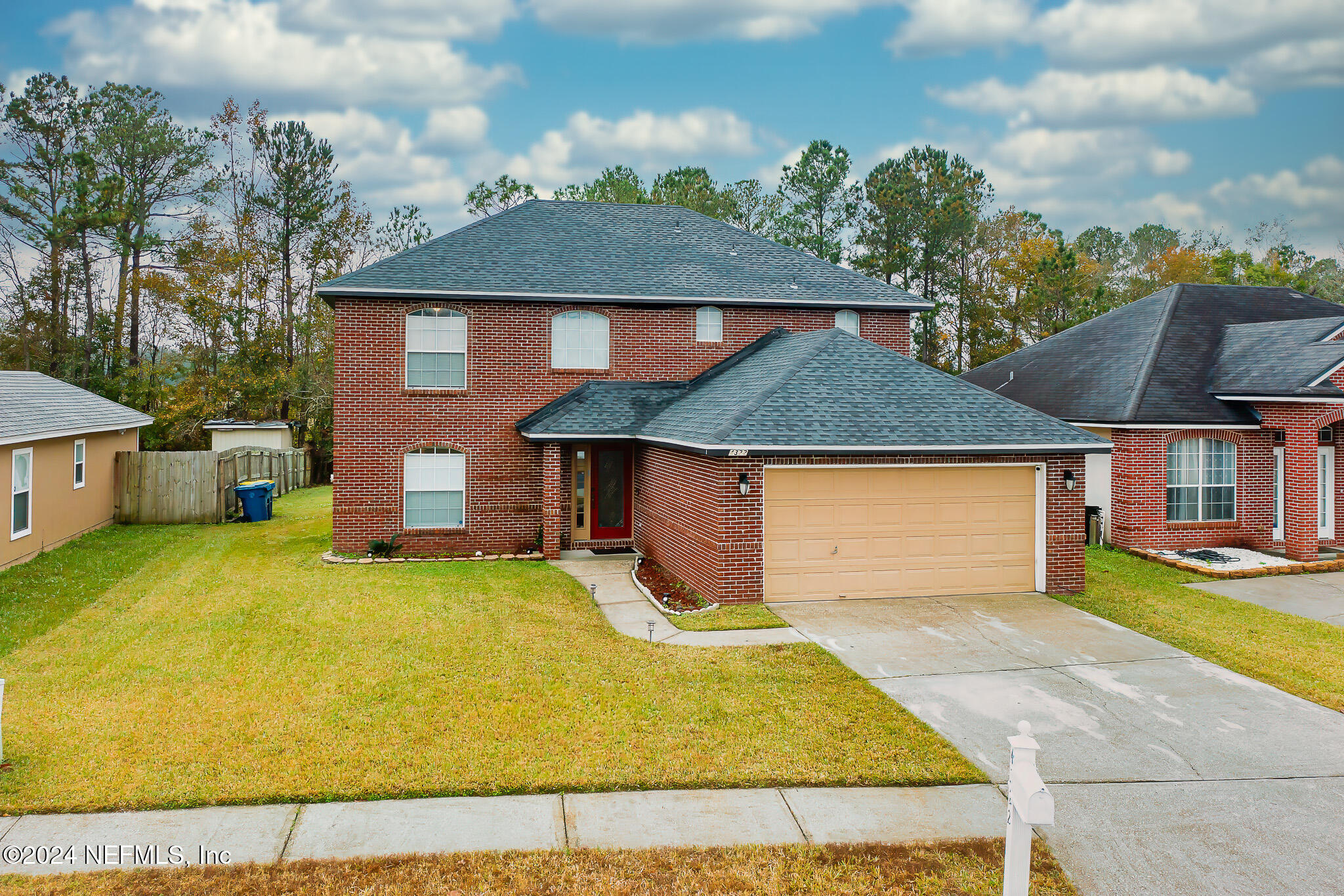 front view of a house with a yard