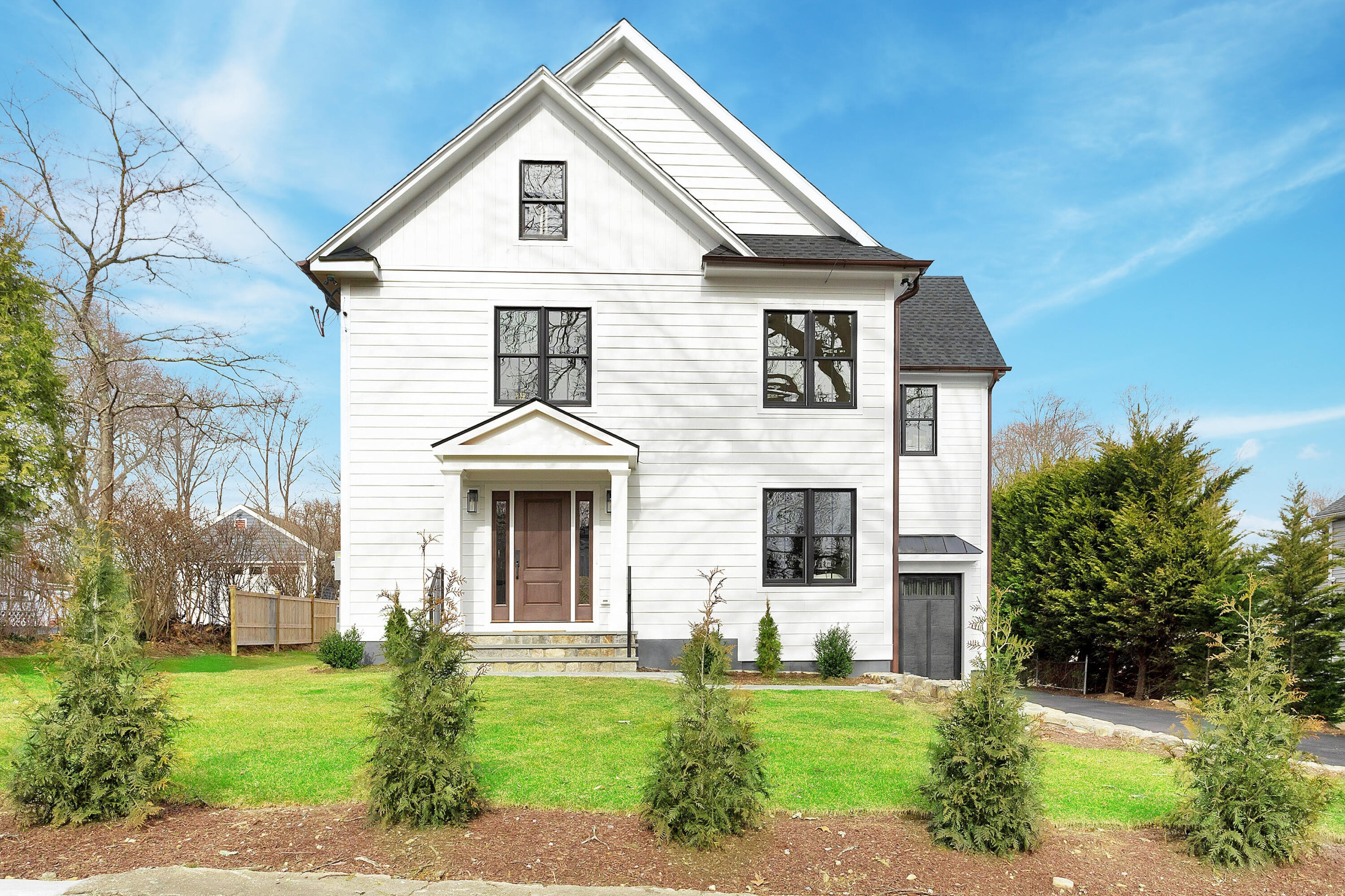 a front view of a house with a yard