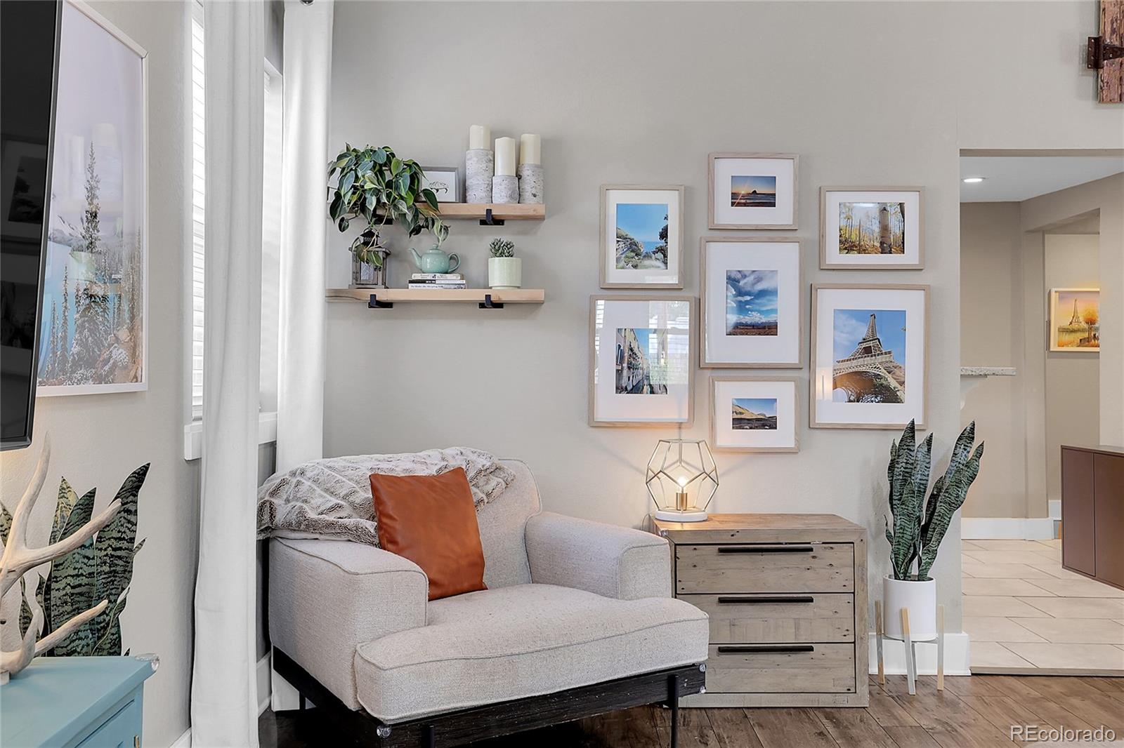 a living room with furniture and flowers