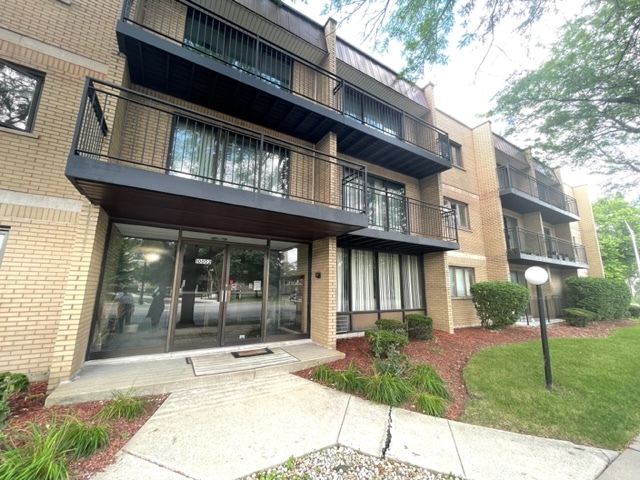 a view of a building with a yard