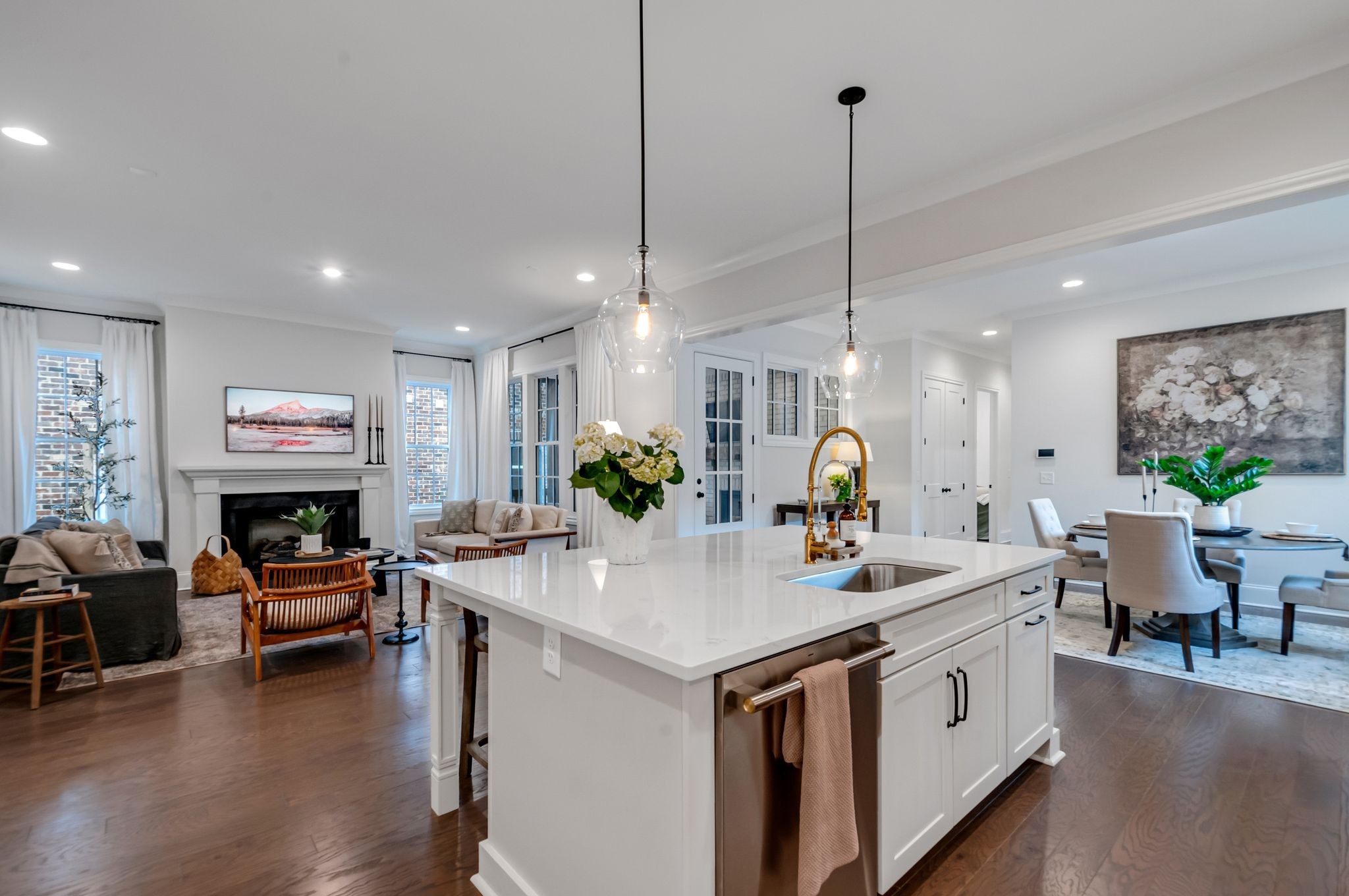 a view of living room kitchen with furniture and fireplace