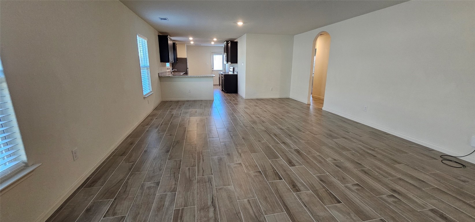 a view of a kitchen from the hallway