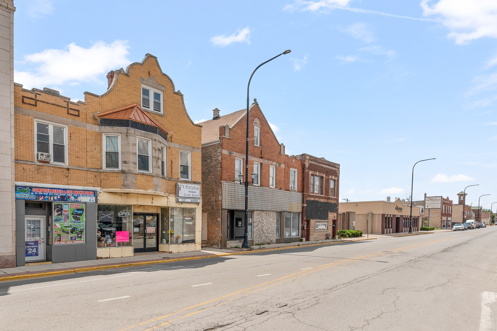 a view of a street with buildings