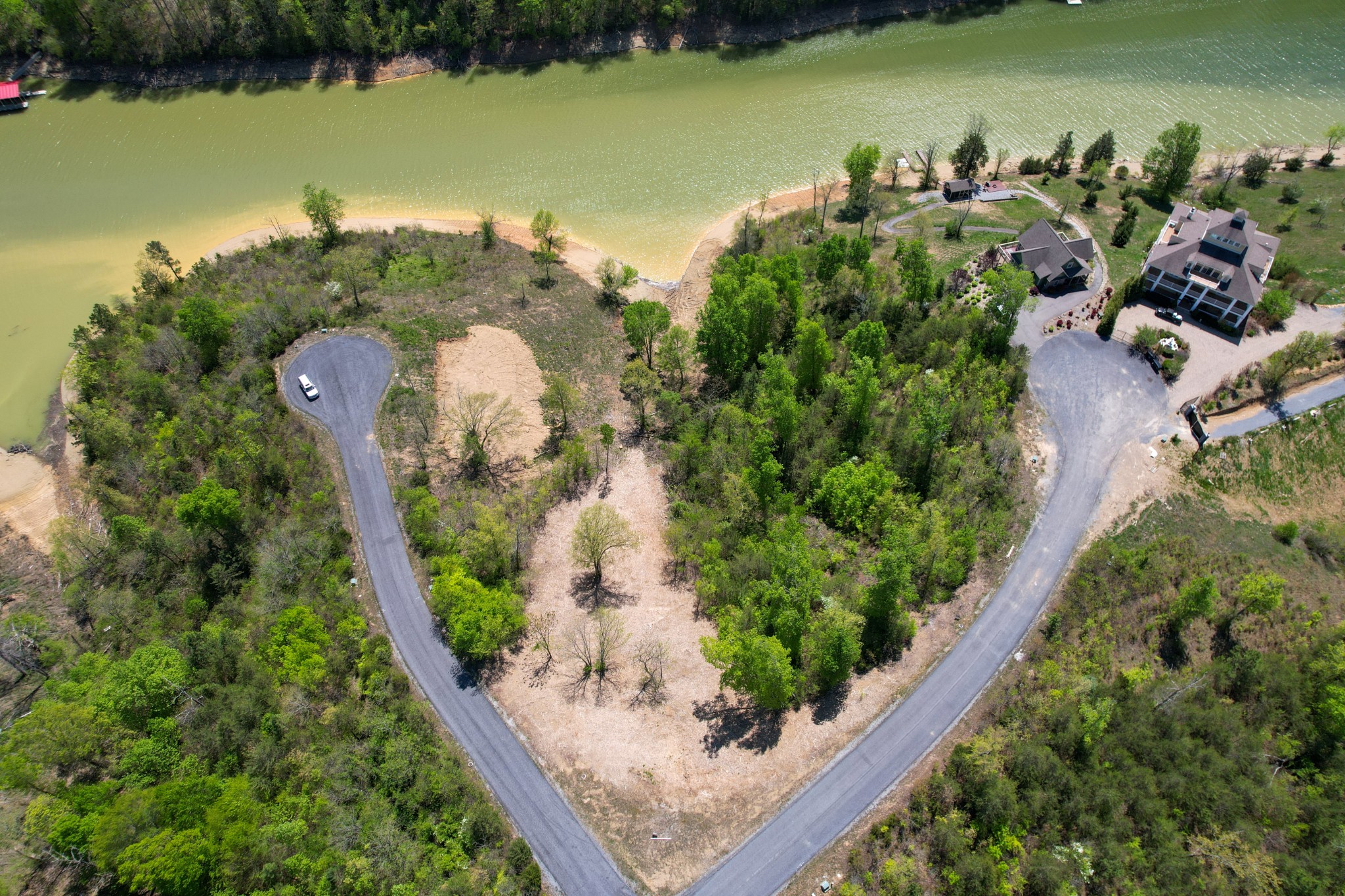 an aerial view of a golf course with chairs