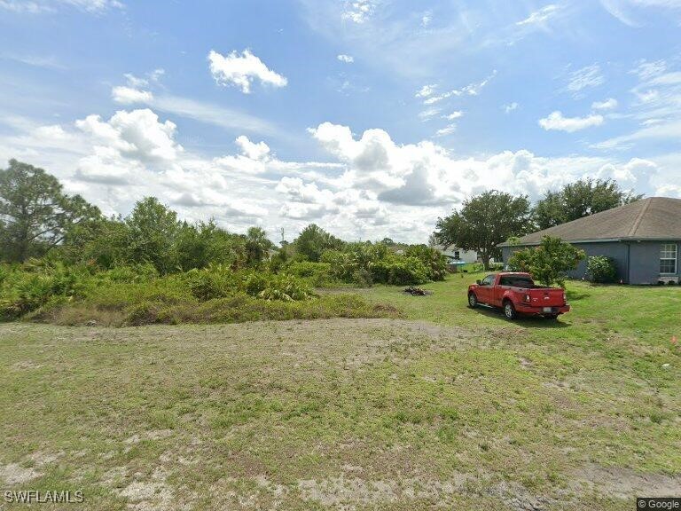 a car parked in the middle of a field