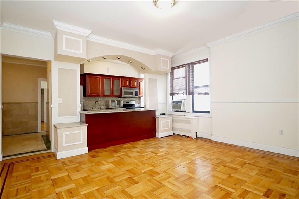 a kitchen with stainless steel appliances a refrigerator and a stove top oven