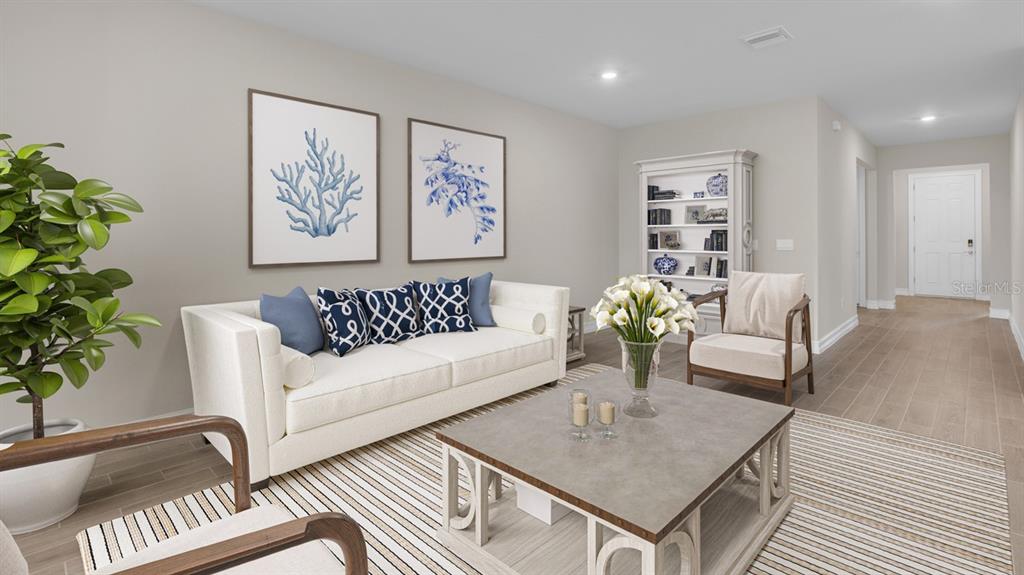 a living room with furniture flowerpot and a chandelier