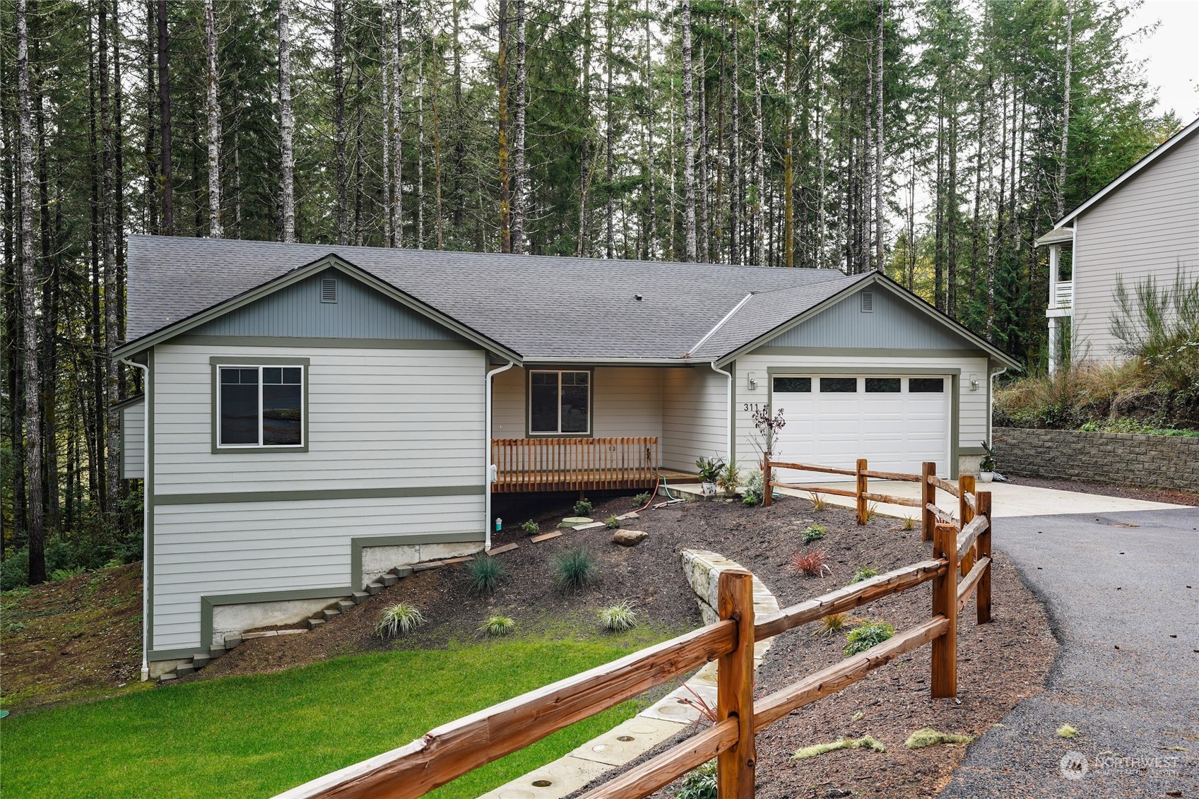 a view of house with backyard