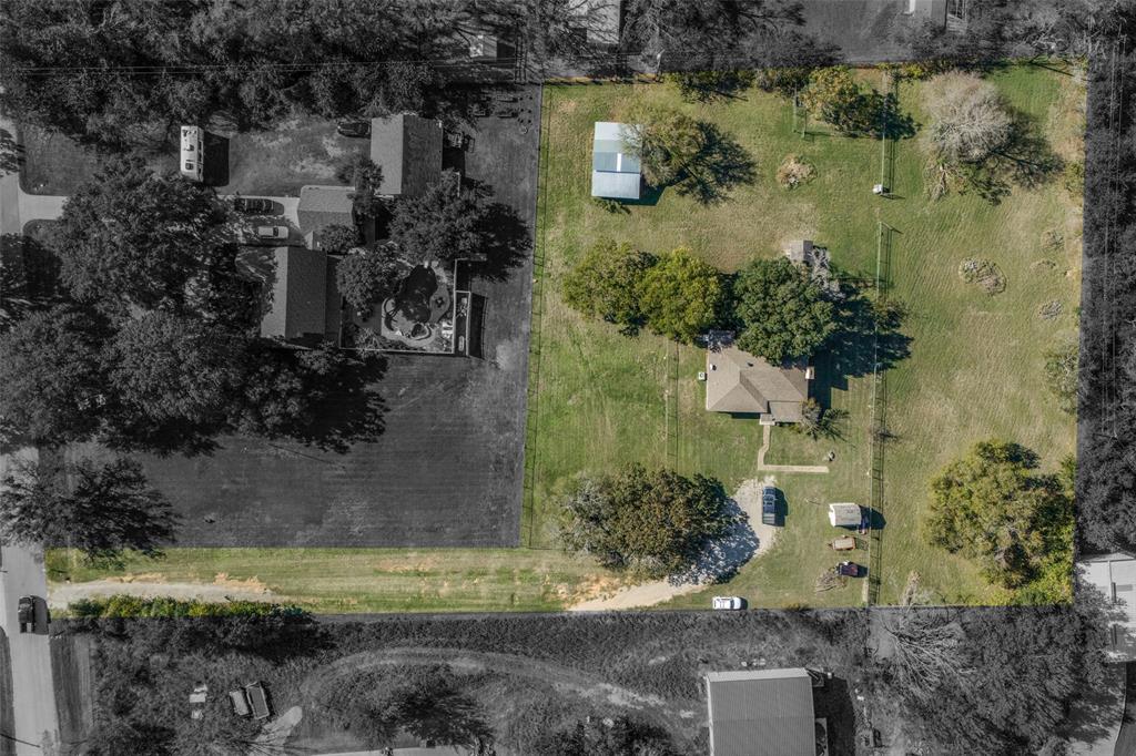 an aerial view of residential house with outdoor space