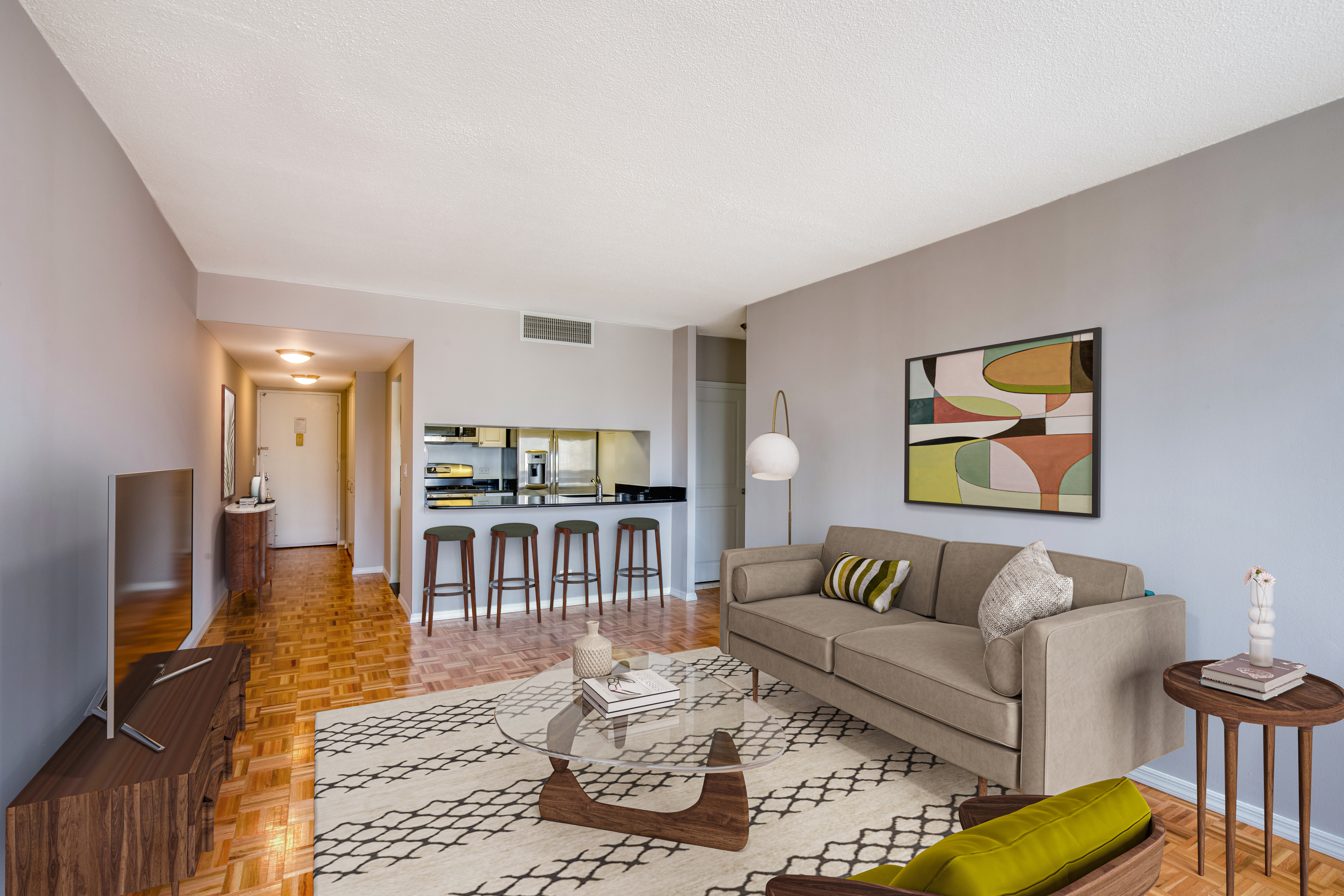 a living room with furniture and a flat screen tv