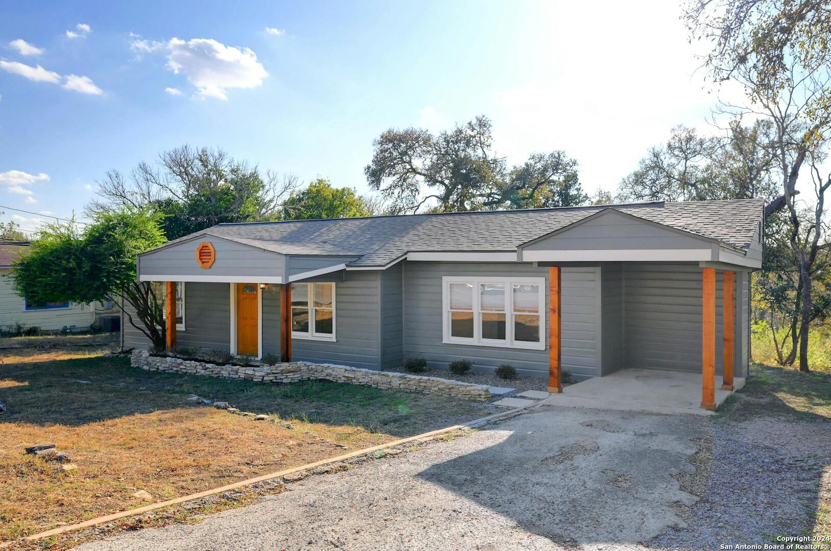 front view of a house with a yard