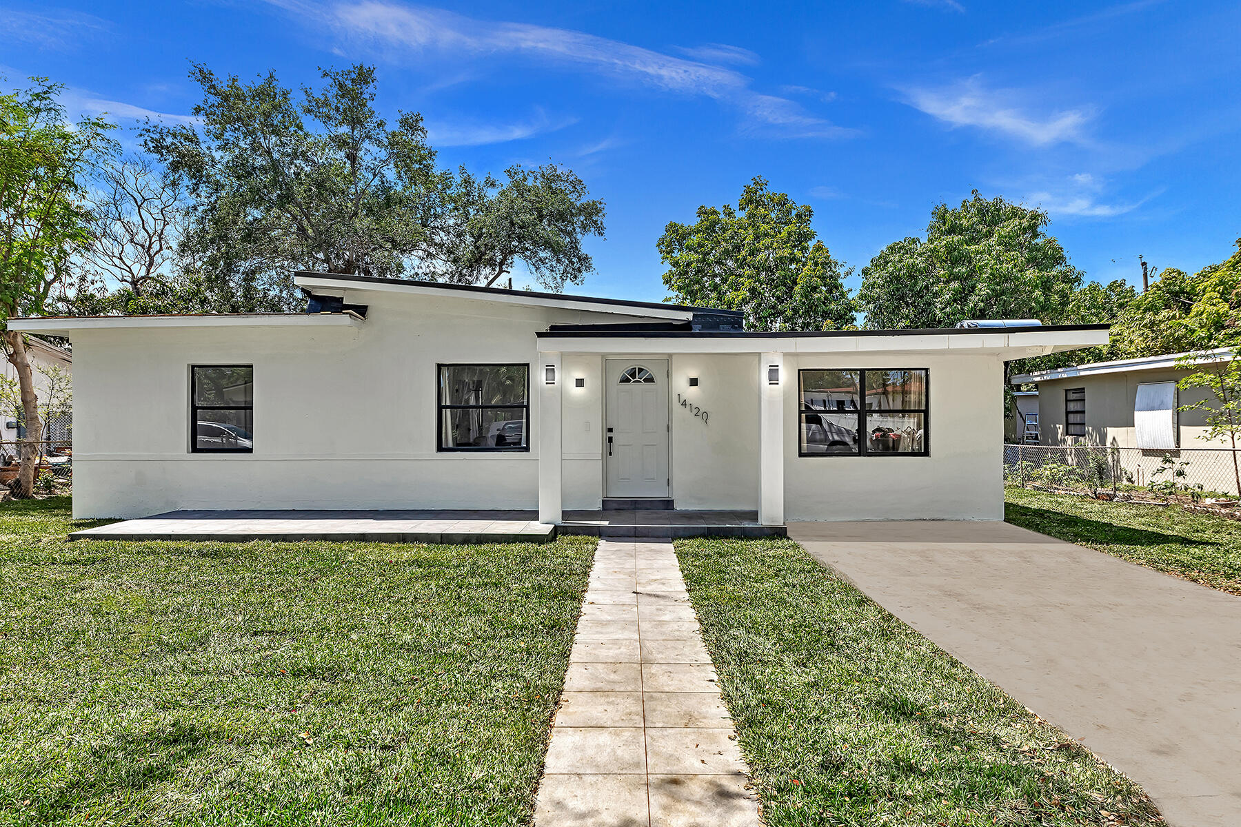 front view of a house with a yard