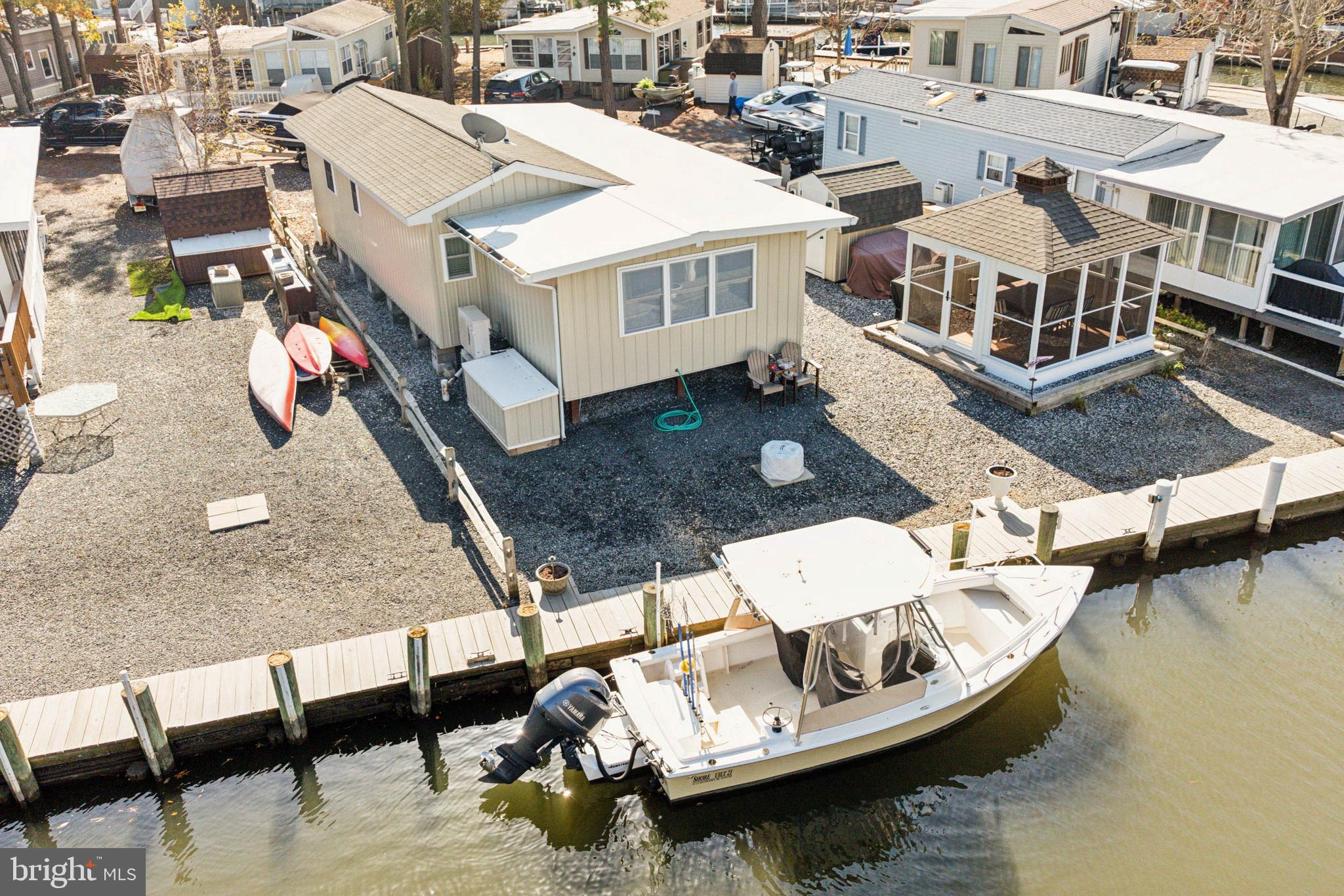 an aerial view of a house with a ocean view