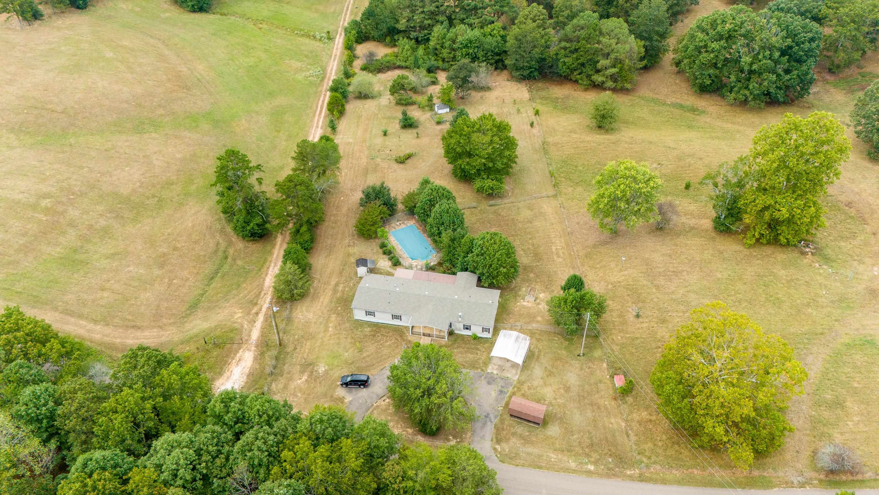 an aerial view of residential houses with swimming pool