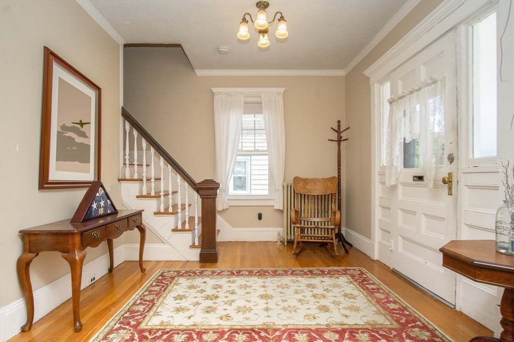 a living room with furniture and a rug