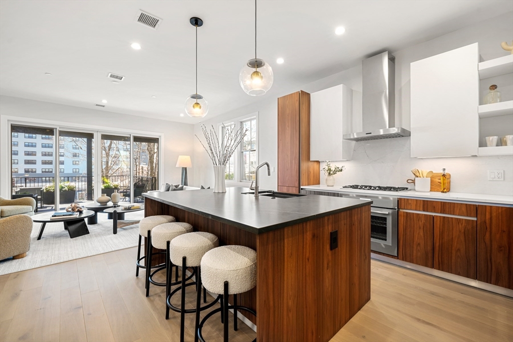 a large kitchen with lots of counter space and a sink