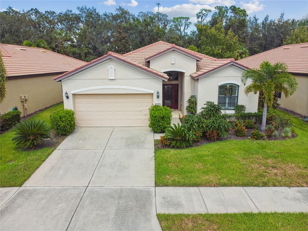 a front view of a house with garden