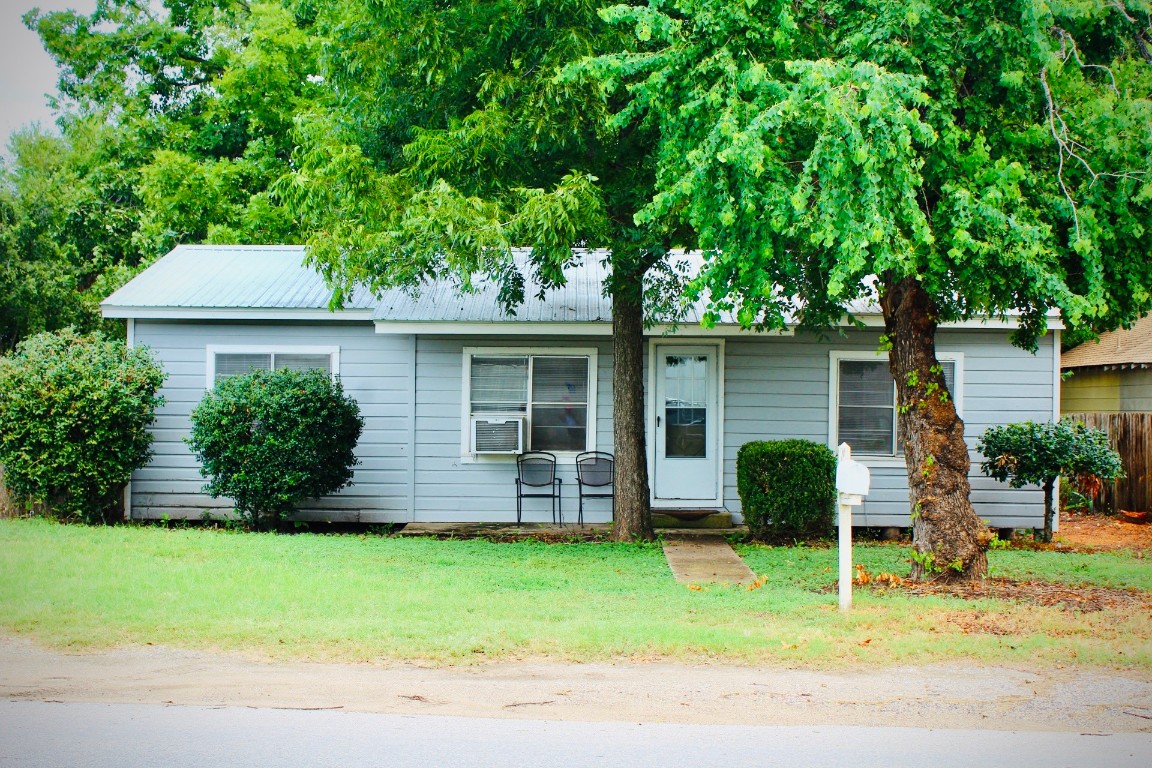 front view of a house with a yard