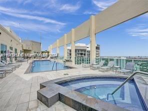 a large pool with table and chairs