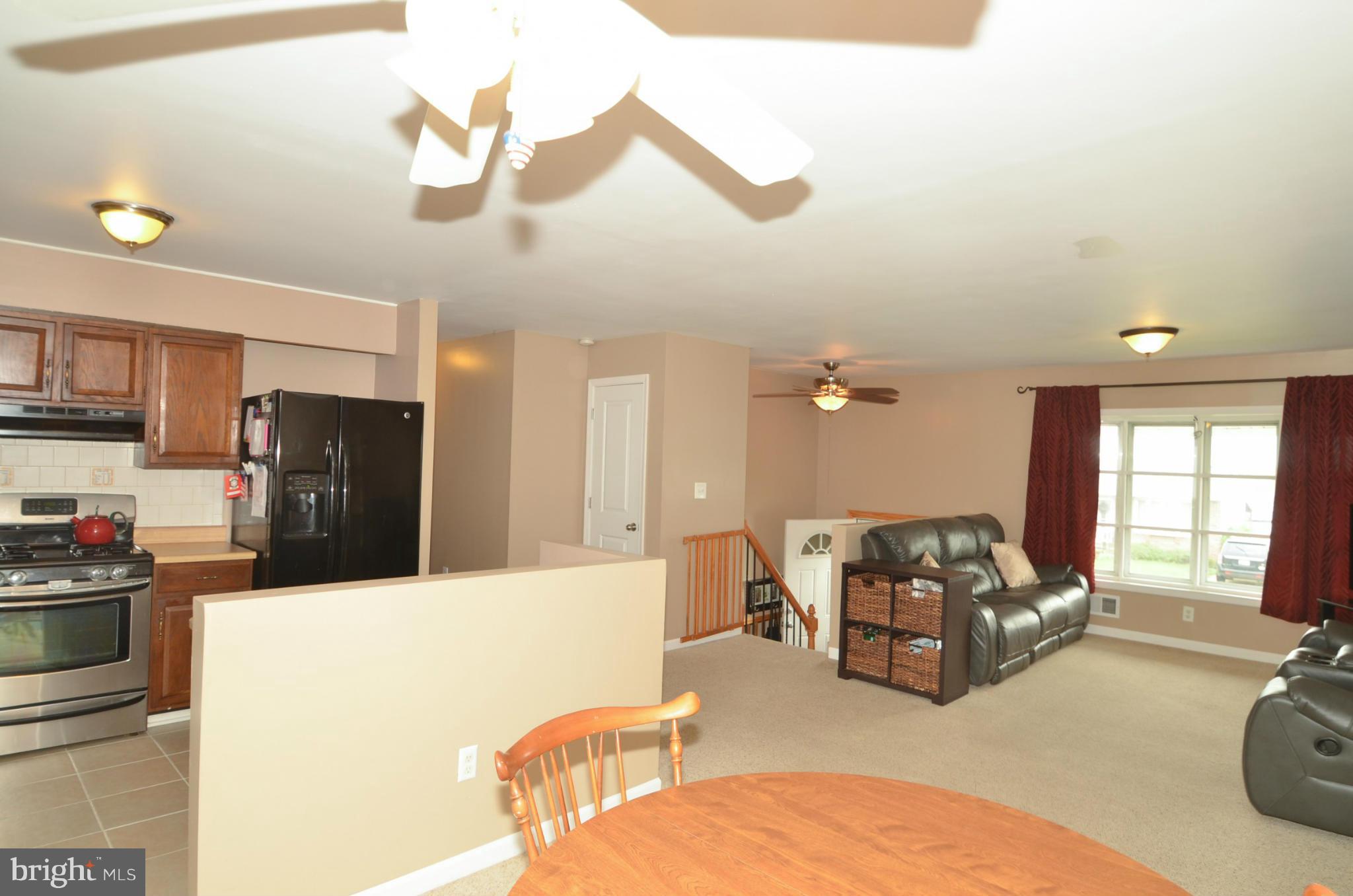 a living room with furniture window and a table