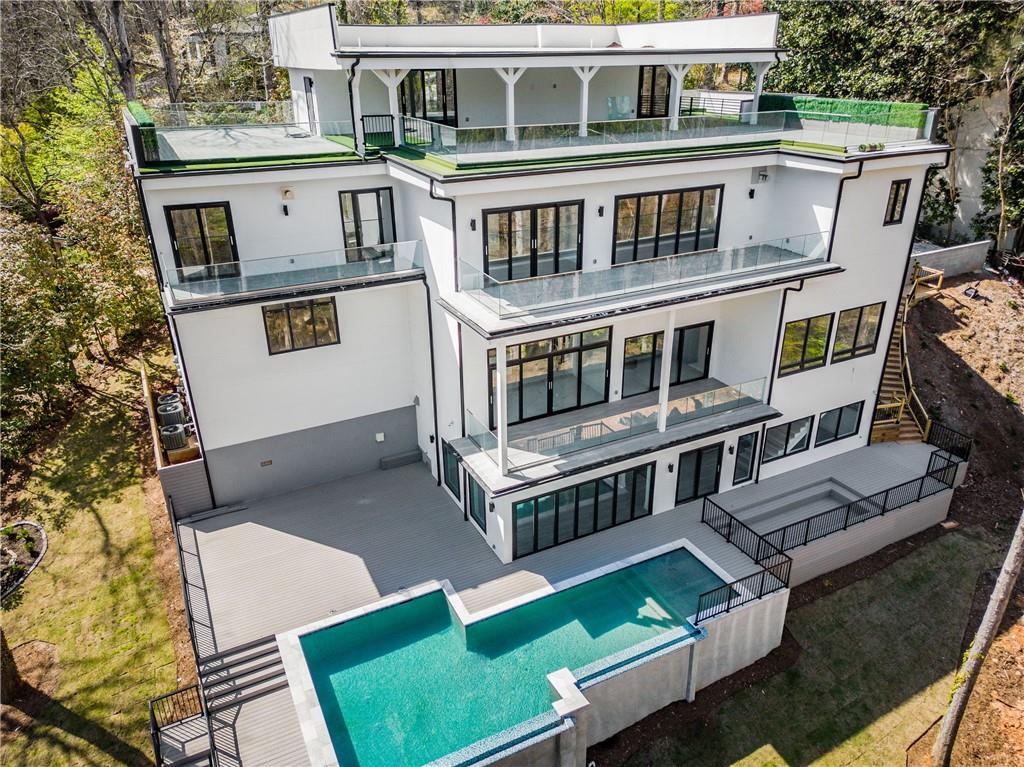 an aerial view of a house with a yard