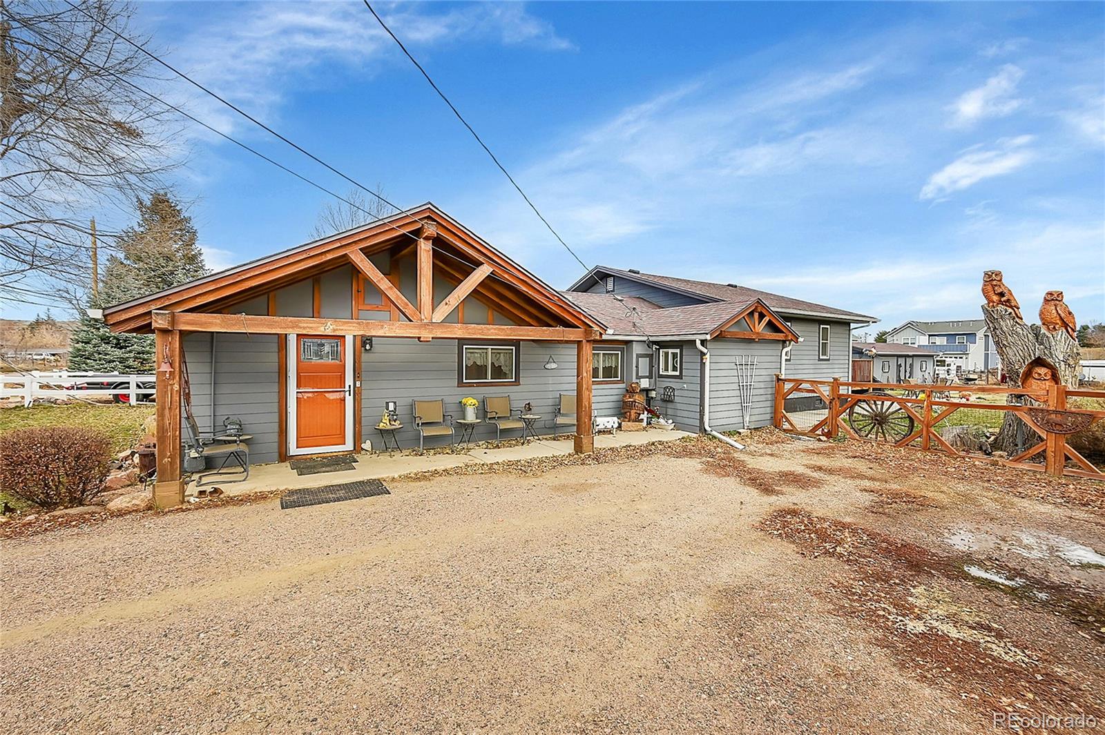 a view of a house with wooden fence