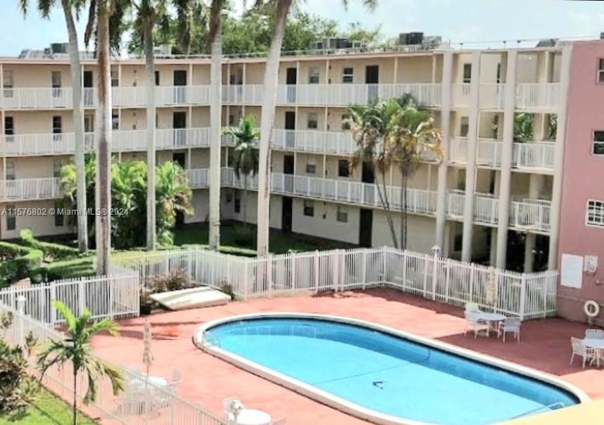 a view of a balcony with a couches and wooden floor