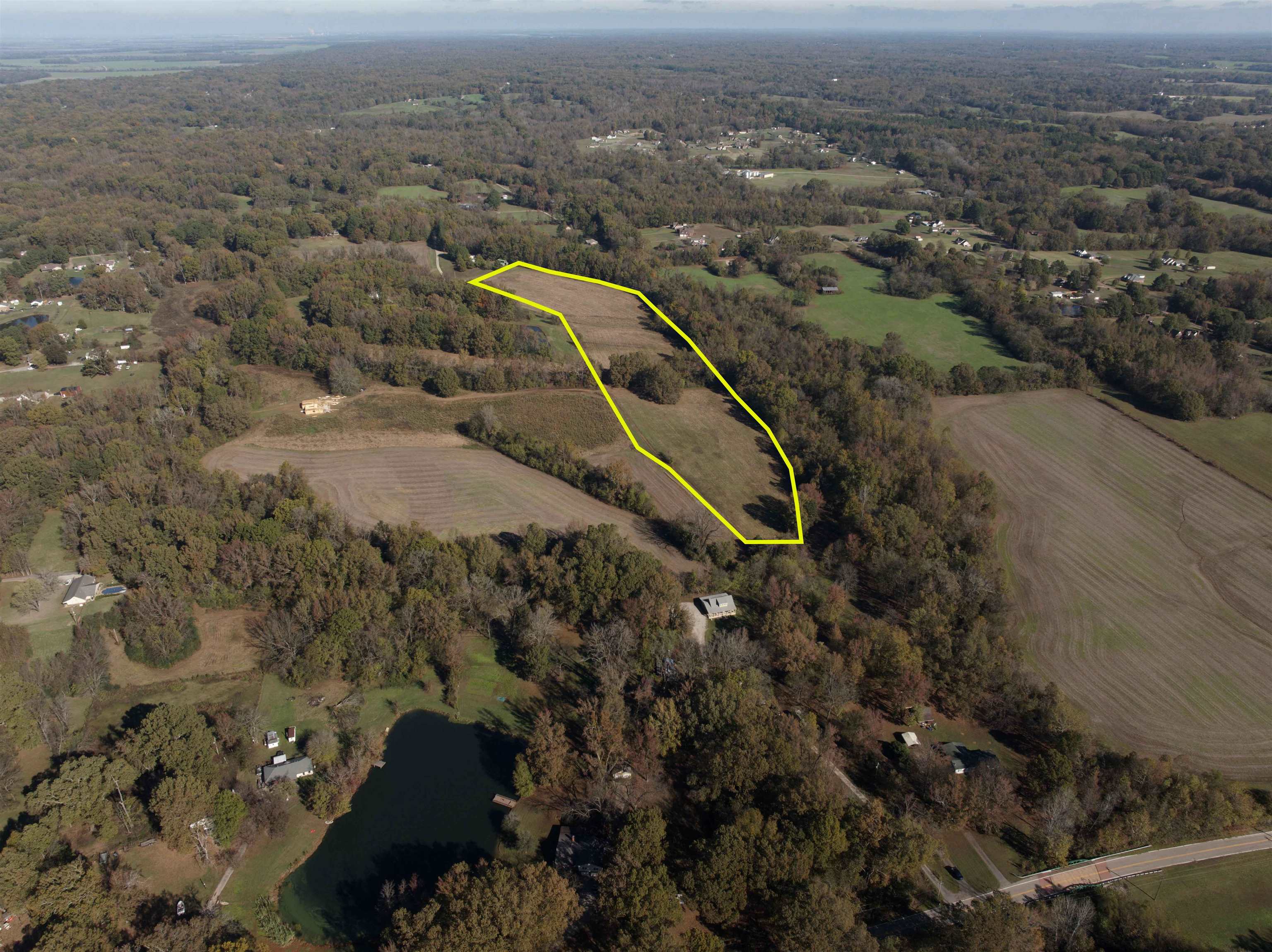 Birds eye view of property with a rural view and a water view. Property lines in photo are approximate.