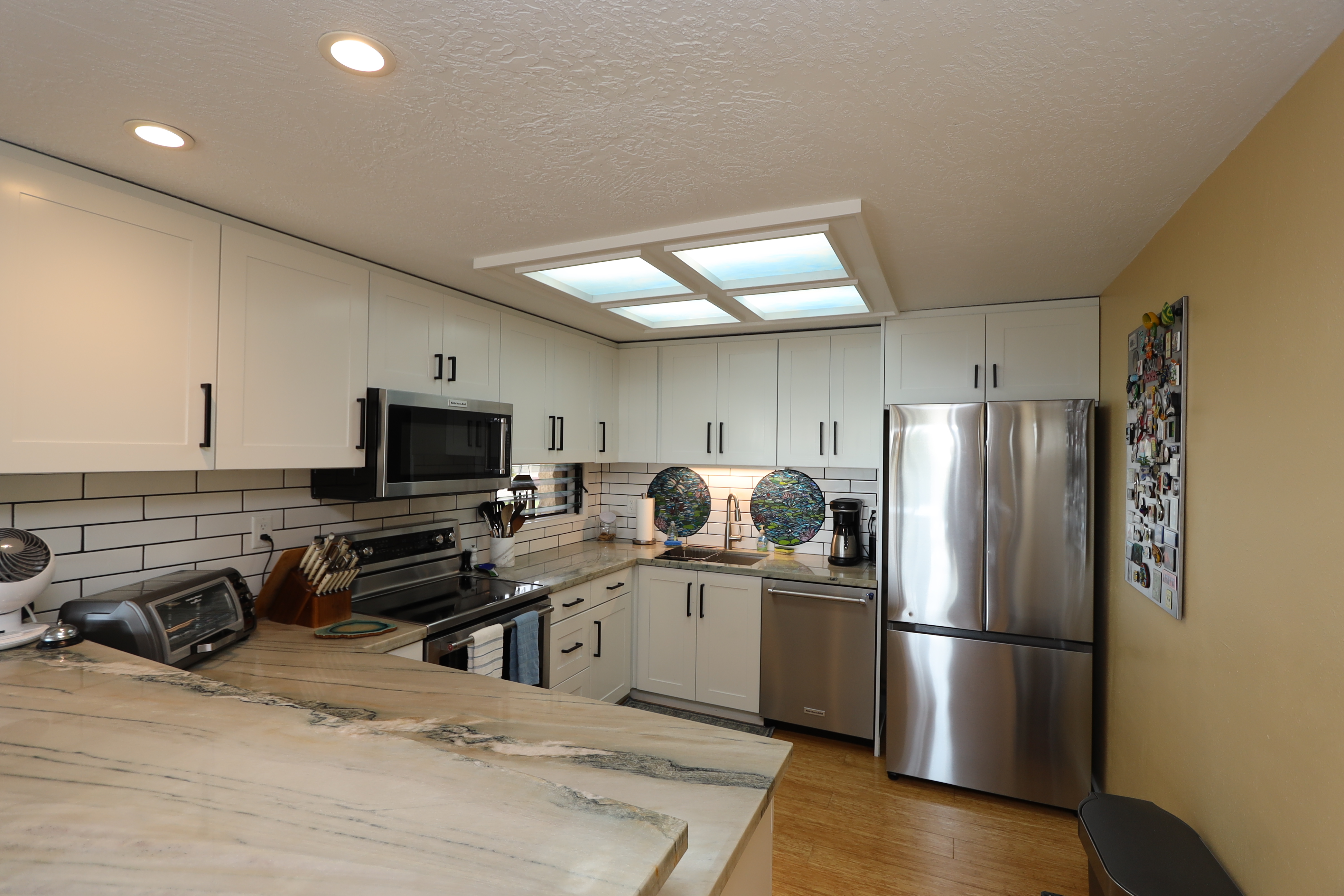 Granite Counters and cabinets freshly resurfaced.